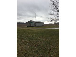 6 Acres with mobile home, 54' x 88' heated and insulated pole building with office, equipment storage, shop, overhead storage and restroom.  Well and 2 septic systems.  24' x 40' livestock or storage building.

Great for mini-farm or additional storage and shop for local farmers.  Excellent potential building site. - 6 Acres with Mobile Home, Pole Building & Storage or Livestock Building